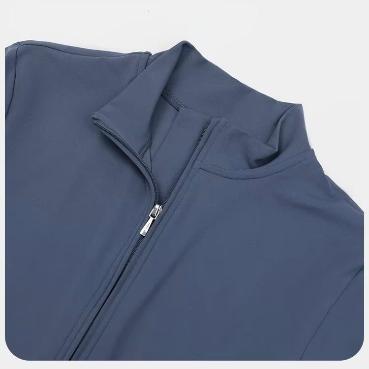 Blue sleeveless jacket with a zipper on a light gray background